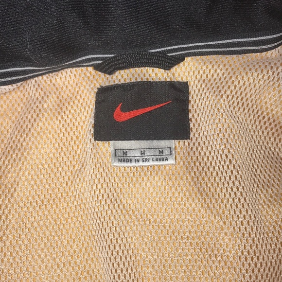 This is a yellow Nike windbreaker - Picture 2 of 5